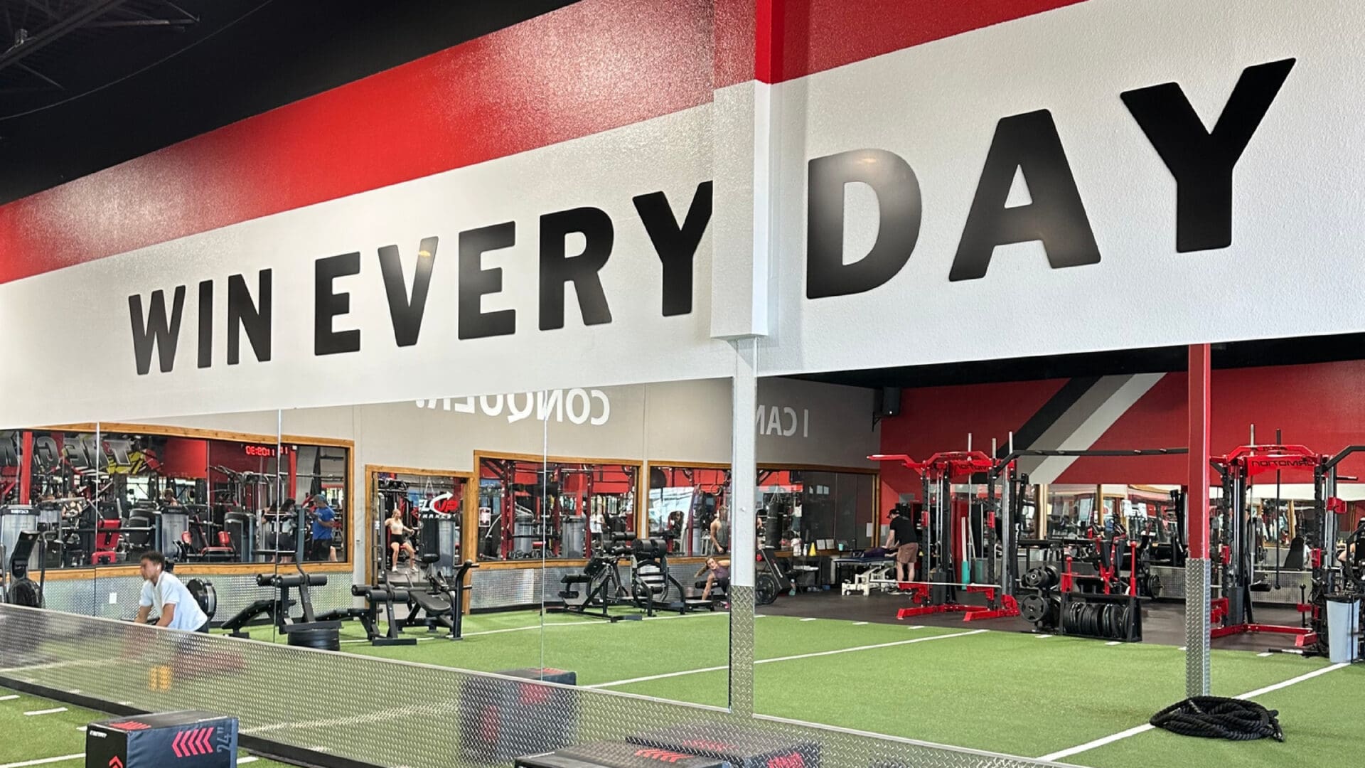 Gym wall mural reading WIN EVERY DAY
