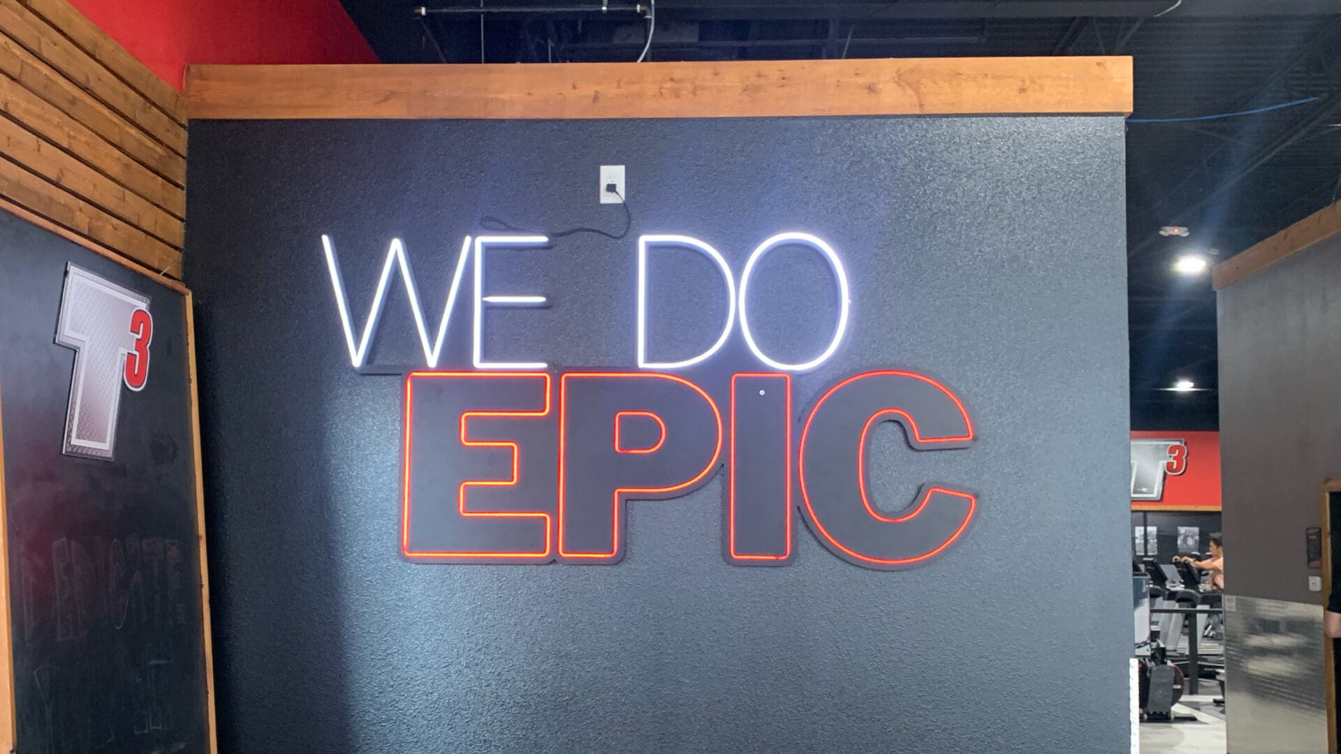 Bold white and red neon motivational sign