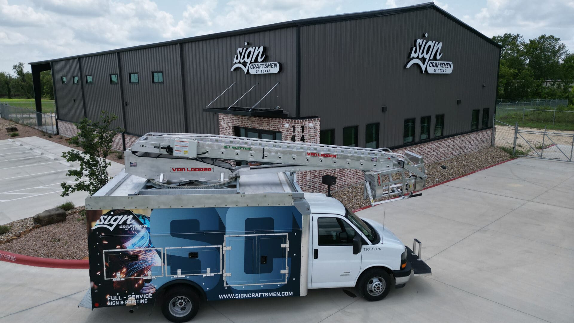 Metal boom ladder folded on vehicle roof