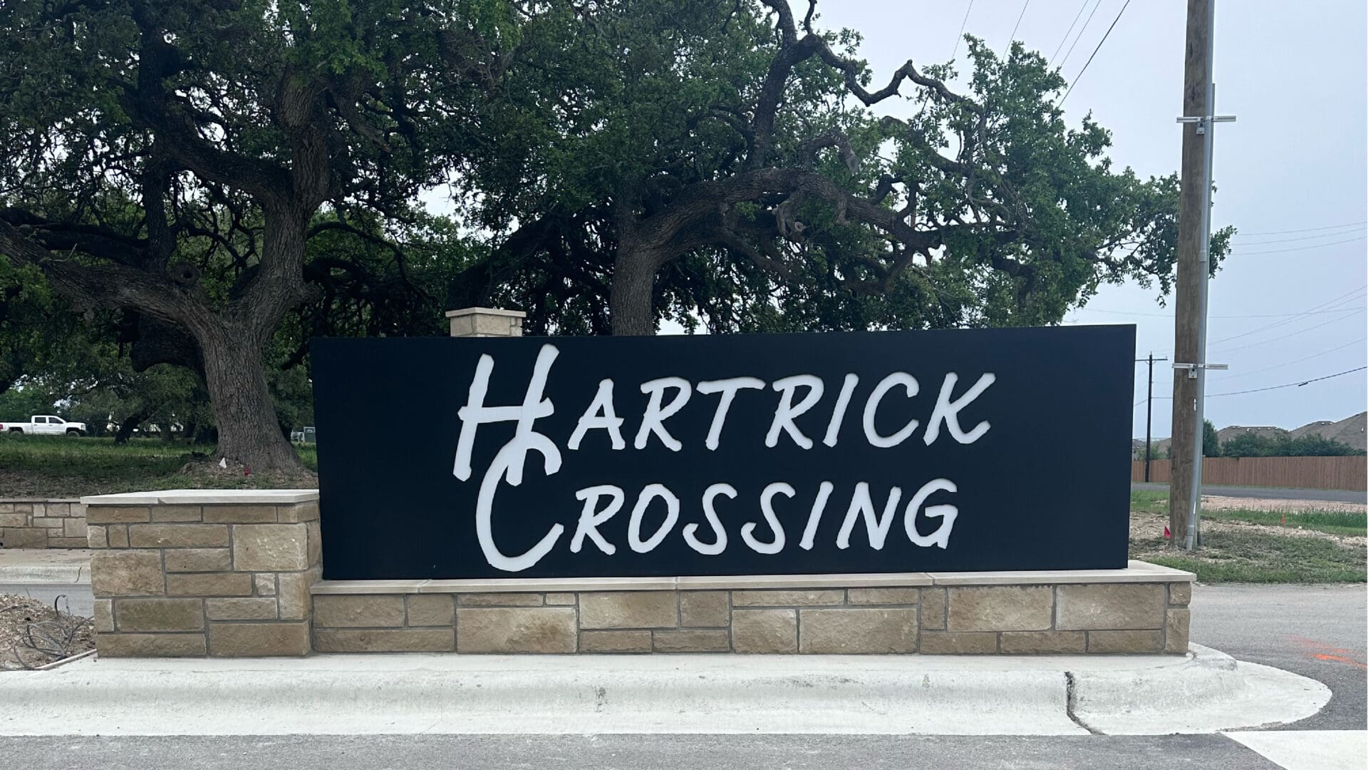 Stone base sign for Hartrick Crossing neighborhood