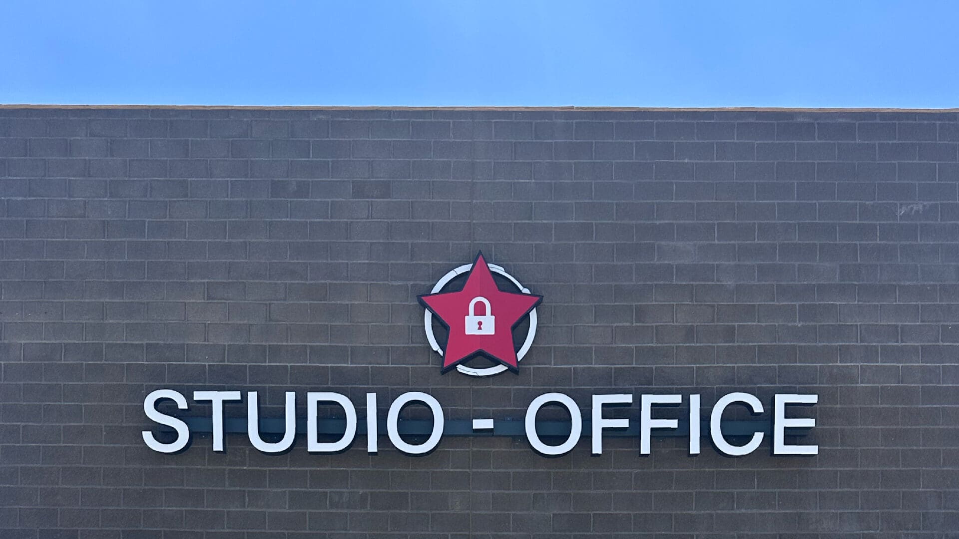 Red star padlock logo above office sign