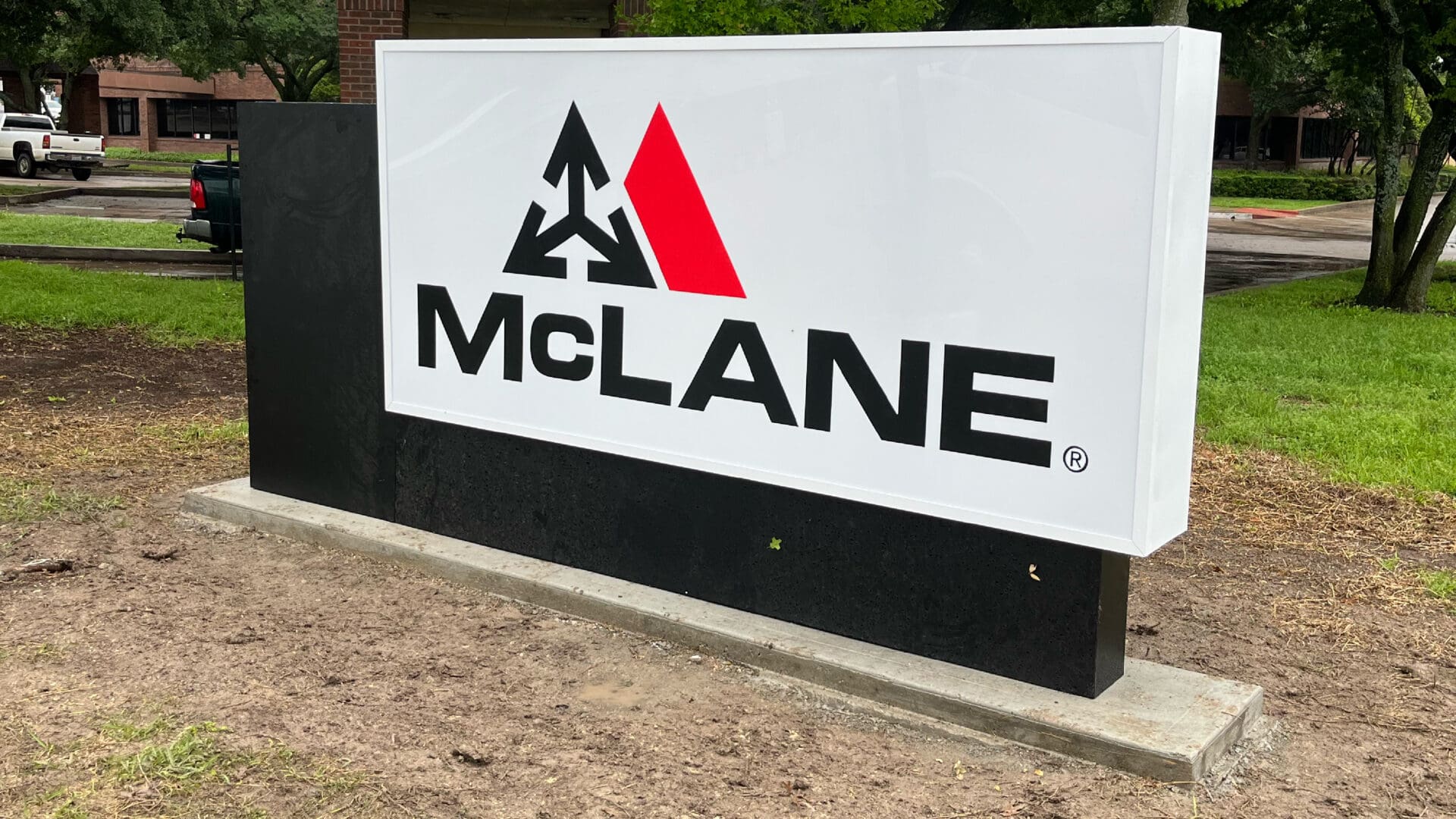 Black base McLane logo display sign