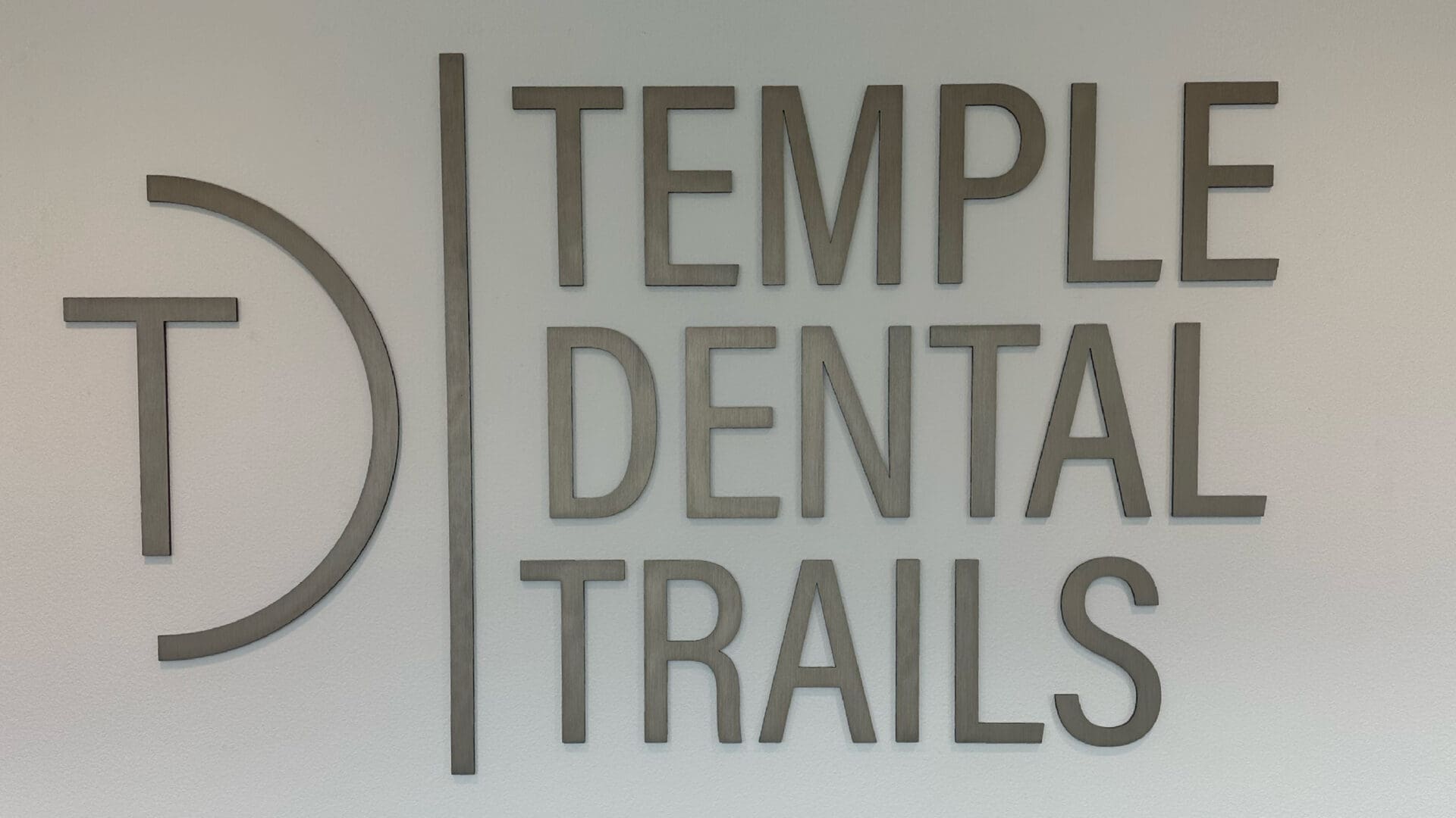 Temple Dental Trails brushed metal wall sign
