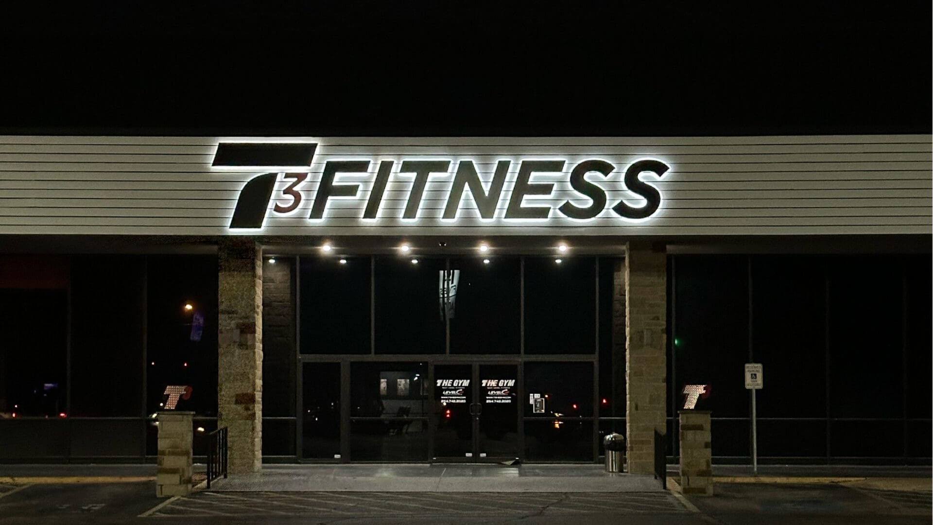 Front facade of fitness center at night