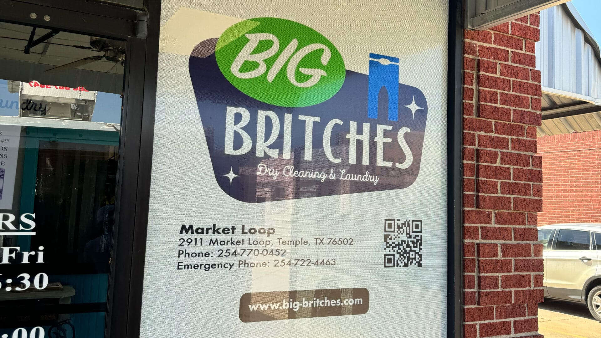 Big Britches dry cleaning storefront window sign